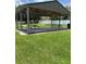 Community pavilion is a great place for picnics and gatherings with picnic tables and well-manicured lawn at 724 Rosemere Cir, Orlando, FL 32835