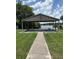 Community pavilion with picnic tables near the lake, perfect for outdoor gatherings and enjoying scenic views at 724 Rosemere Cir, Orlando, FL 32835
