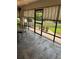View of porch with tile flooring, overlooking brick walkway and lush landscaping at 724 Rosemere Cir, Orlando, FL 32835