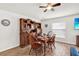 Dining area with wooden furniture set, a decorative hutch, and a view to the TV at 733 Citrus Reserve Blvd, Davenport, FL 33837