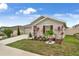 Charming home featuring a well-manicured lawn and beautiful tropical landscaping at 733 Citrus Reserve Blvd, Davenport, FL 33837