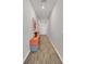 Bright hallway features wood-look tile flooring, leading to the rest of the home's living spaces at 733 Citrus Reserve Blvd, Davenport, FL 33837