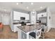 Modern kitchen with white cabinets, stainless steel appliances, and center island with bar seating at 733 Citrus Reserve Blvd, Davenport, FL 33837