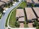 Birds eye view of a corner lot home with brick driveway and manicured landscaping at 8800 Corcovado Dr, Kissimmee, FL 34747