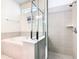 Bathroom showcasing a shower, tub, and tile surround at 8800 Corcovado Dr, Kissimmee, FL 34747