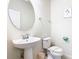 Bathroom featuring a pedestal sink and toilet at 8800 Corcovado Dr, Kissimmee, FL 34747
