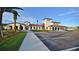 Beautiful clubhouse exterior featuring an elegant design, manicured landscaping, and ample parking at 8800 Corcovado Dr, Kissimmee, FL 34747