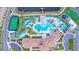 Overhead view of a resort-style pool with lazy river, playground, and lakeside clubhouse at 8800 Corcovado Dr, Kissimmee, FL 34747