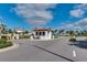 Image of a secured gated entrance to a community featuring lush landscaping and tiled roof at 8800 Corcovado Dr, Kissimmee, FL 34747