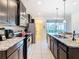 Modern kitchen with granite countertops, stainless steel appliances, and ample cabinet space at 8800 Corcovado Dr, Kissimmee, FL 34747