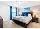 The beautifully appointed main bedroom features a king bed, stylish decor, and ample natural light at 8800 Corcovado Dr, Kissimmee, FL 34747