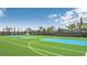 Multi-sport court area featuring basketball hoops, a net, and painted lines at 8800 Corcovado Dr, Kissimmee, FL 34747