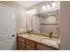 Elegant bathroom with a double sink vanity, granite countertops, and a large mirror, and tiled shower, providing ample space at 891 Cr 482C, Lake Panasoffkee, FL 33538