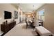 Open-concept living and dining area with modern furnishings, a dining table for eight, and bright natural light at 891 Cr 482C, Lake Panasoffkee, FL 33538