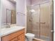 Bathroom featuring a glass shower and vanity at 9335 San Jose Blvd, Howey In The Hills, FL 34737