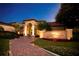 Attractive exterior of a spa building with beautiful landscaping, a tiled walkway, and lighted columns at 9335 San Jose Blvd, Howey In The Hills, FL 34737