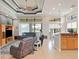 Open living space featuring high ceilings, tile floors and natural light from large windows at 9335 San Jose Blvd, Howey In The Hills, FL 34737