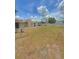 Expansive backyard featuring a bird bath and a privacy fence, perfect for outdoor activities and relaxation at 100 W Idlewild Ave, Eustis, FL 32726