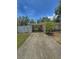 Charming single-story home with a long driveway and carport at 100 W Idlewild Ave, Eustis, FL 32726