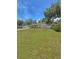 Charming single-story home with a well-maintained lawn and a white fence, offering a welcoming curb appeal at 100 W Idlewild Ave, Eustis, FL 32726