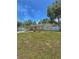 Charming single-story home with a well-maintained lawn and a white fence, offering a welcoming curb appeal at 100 W Idlewild Ave, Eustis, FL 32726