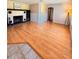 Spacious living room with hardwood floors and a cozy fireplace at 100 W Idlewild Ave, Eustis, FL 32726