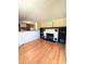 Open living area features a fireplace and view into the kitchen at 100 W Idlewild Ave, Eustis, FL 32726