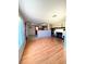 Open-concept living area with hardwood floors, fireplace, and natural light at 100 W Idlewild Ave, Eustis, FL 32726