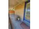Inviting porch features a cozy chair and decor at 100 W Idlewild Ave, Eustis, FL 32726