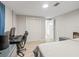 Bright bedroom featuring wood floors, closet, and space for relaxing and working at 1005 Richard Dr, The Villages, FL 32159