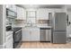Efficient kitchen with stainless steel appliances, ample counter space, a stainless dishwasher and bright lighting at 1005 Richard Dr, The Villages, FL 32159