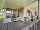 Cozy screened-in porch with access to the home, offering an inviting outdoor relaxation space at 1005 Richard Dr, The Villages, FL 32159