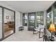 Bright sunroom with large windows, seamlessly connecting the indoors with views of the surrounding landscape at 1005 Richard Dr, The Villages, FL 32159