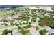 Aerial view of a community and clubhouse with manicured landscaping and an attractive environment at 101 Flame Vine Way, Groveland, FL 34736