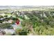 Image of a house with a community clubhouse and surrounding greenery at 101 Flame Vine Way, Groveland, FL 34736