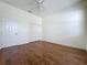 Bedroom features wood floors, ceiling fan, a door and closet at 101 Flame Vine Way, Groveland, FL 34736