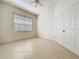 Corner bedroom features tile floors, large closet, window and ceiling fan at 101 Flame Vine Way, Groveland, FL 34736