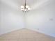 Corner view of the dining room showcasing tile floor, fixture and neutral walls at 101 Flame Vine Way, Groveland, FL 34736