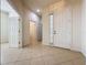Spacious tiled foyer and hallway with neutral decor and natural light at 101 Flame Vine Way, Groveland, FL 34736