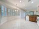 Open kitchen with bright natural light and plenty of space for cooking at 101 Flame Vine Way, Groveland, FL 34736