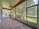 Enjoy outdoor living on this screened lanai with brick floor and lovely wooded views at 101 Flame Vine Way, Groveland, FL 34736