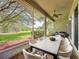 Spacious screened patio includes a large dining table and outdoor grilling area at 101 Flame Vine Way, Groveland, FL 34736