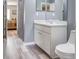 This bathroom features a single vanity and gray walls at 1132 Hill Mount Dr, Minneola, FL 34715