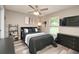 This bedroom offers a large window and modern furniture at 1132 Hill Mount Dr, Minneola, FL 34715