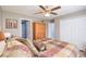 This bedroom offers a closet and wood-look laminate flooring at 1132 Hill Mount Dr, Minneola, FL 34715