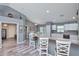 Open dining area with laminate flooring and easy access to the kitchen and outdoor pool area at 1132 Hill Mount Dr, Minneola, FL 34715