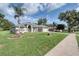 Charming single-story home with well-manicured lawn and landscaping at 1132 Hill Mount Dr, Minneola, FL 34715