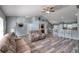 Open floor plan showcasing the living room, dining area, and kitchen with breakfast bar at 1132 Hill Mount Dr, Minneola, FL 34715