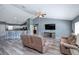The open floor plan shows the living room and kitchen area, great for entertaining at 1132 Hill Mount Dr, Minneola, FL 34715