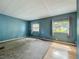 Bright bedroom features ample natural light and views of the outdoors at 1156 Capella Dr, Tavares, FL 32778